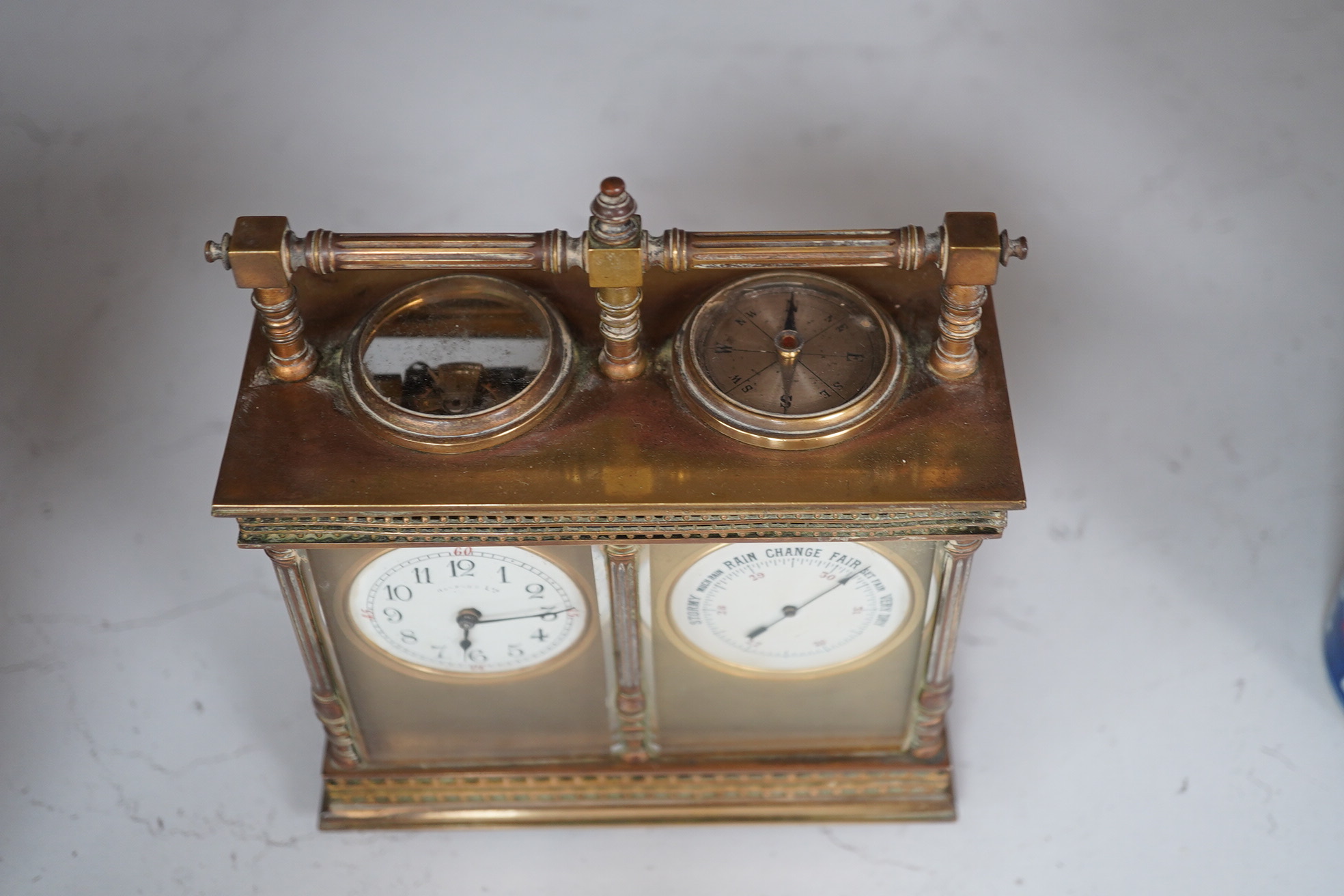 A French eight day carriage timepiece / barometer, retailed by Harrods, 16cm. Condition - fair, not tested